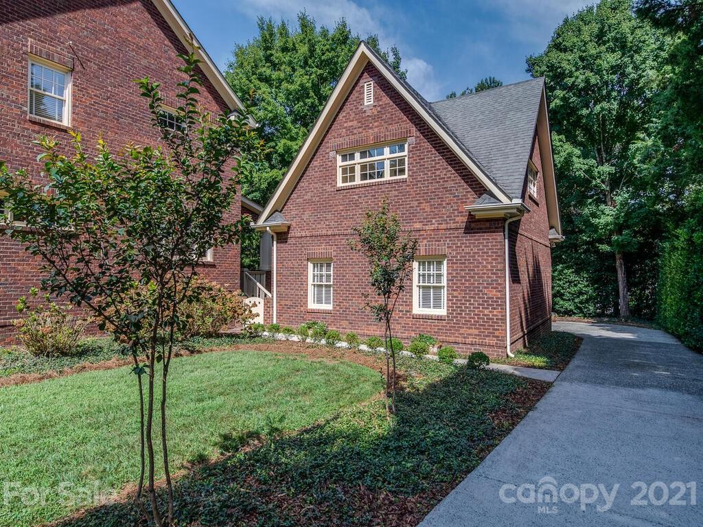 4608 Nora's Path Road Charlotte, NC 28226 - Photo 35 of 39 a front view of a house with a yard