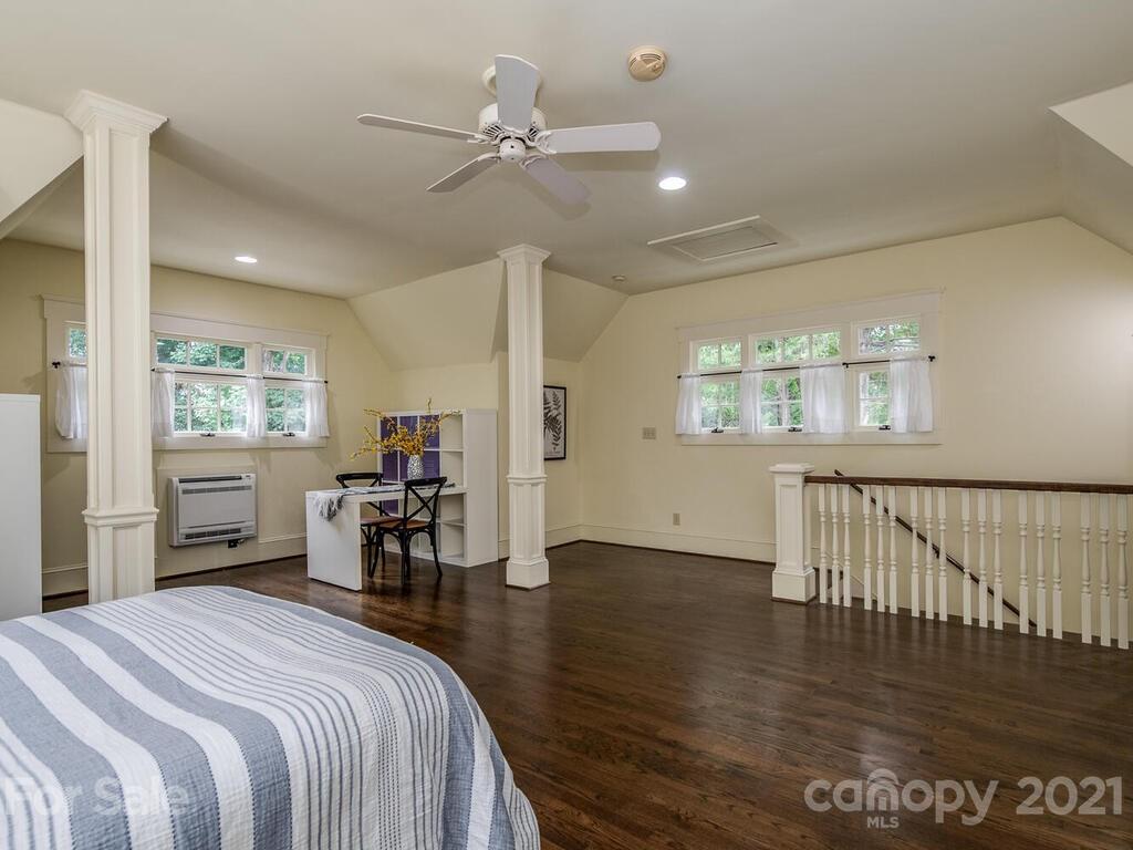 4608 Nora's Path Road Charlotte, NC 28226 - Photo 38 of 39 a bed room with a bed and a chair