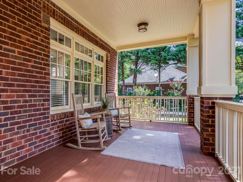 4608 Nora's Path Road Charlotte, NC 28226 - Photo 6 of 39 a balcony with furniture and a potted plant
