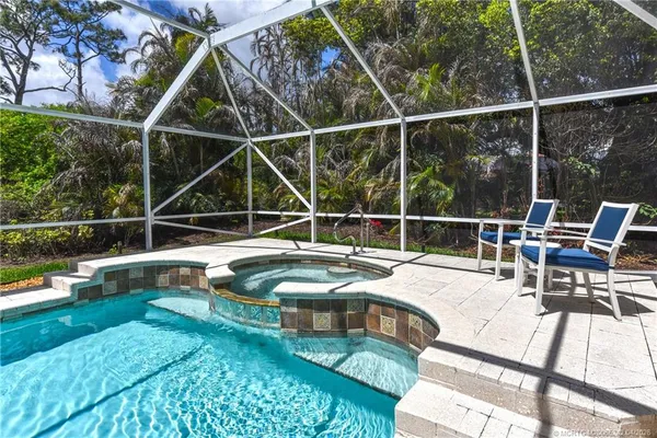 a view of a house with backyard sitting area and porch