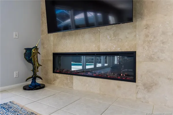 a kitchen with stainless steel appliances granite countertop a sink and a refrigerator