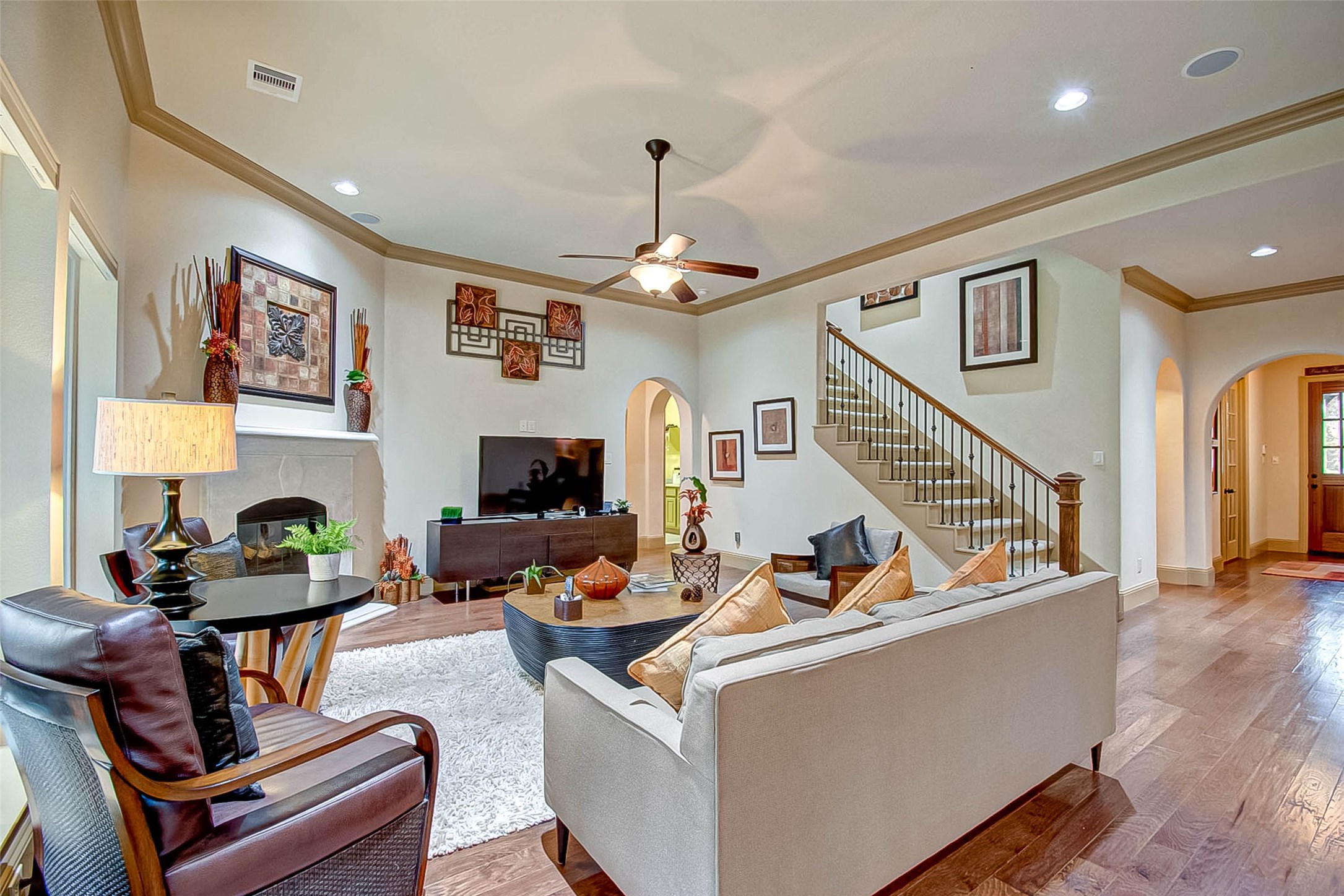 7 Shearling Court Spring, TX 77389 - Photo 11 of 46 a living room with furniture and a flat screen tv