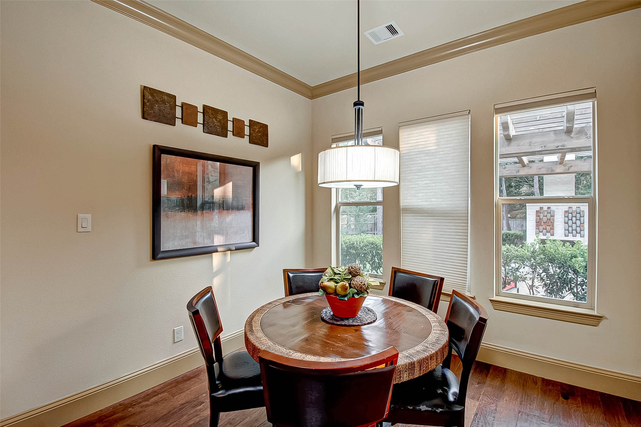 7 Shearling Court Spring, TX 77389 - Photo 20 of 46 a dining room with furniture a chandelier and wooden floor