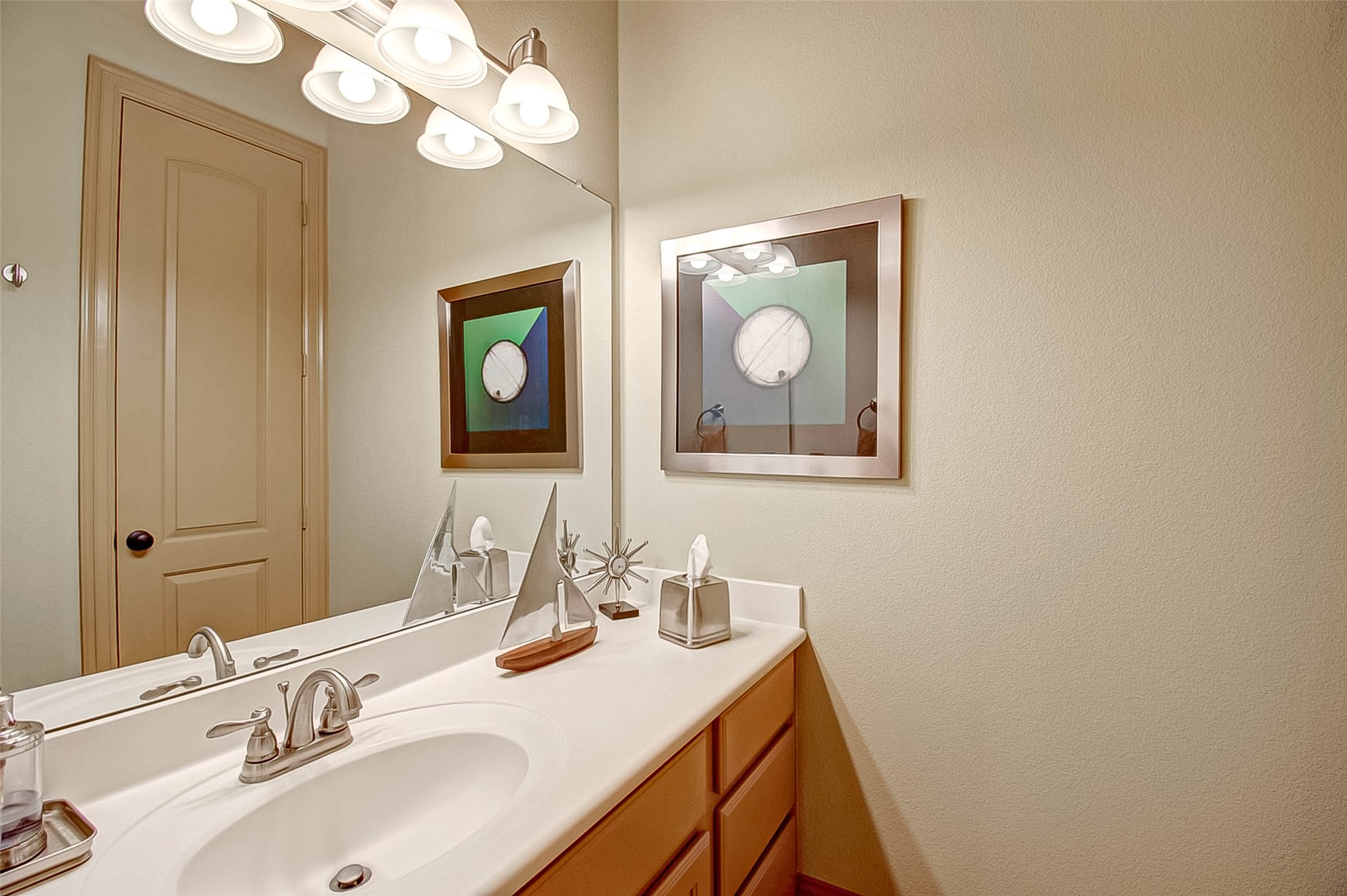 7 Shearling Court Spring, TX 77389 - Photo 26 of 46 a bathroom with a sink vanity and a mirror