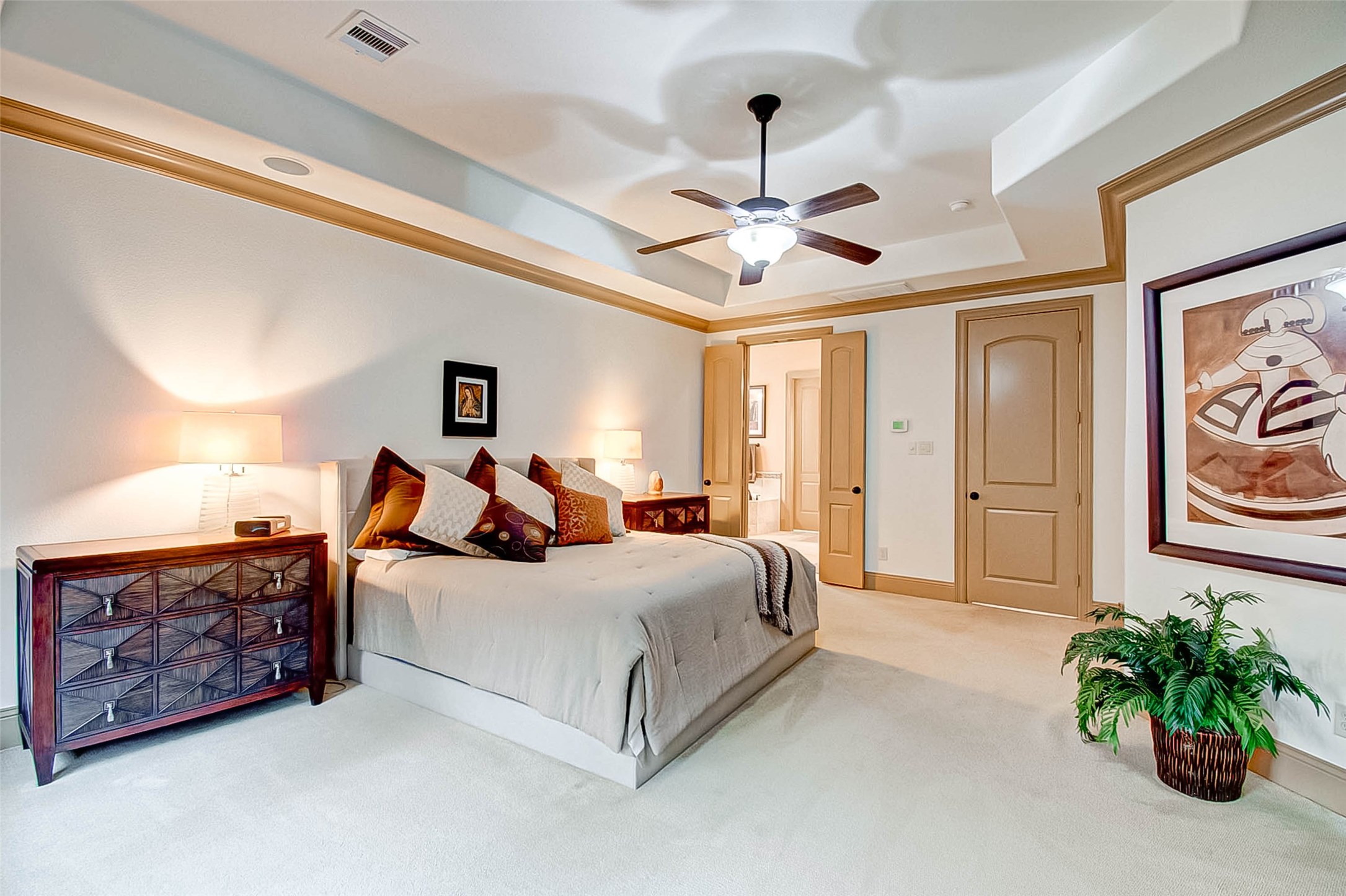 7 Shearling Court Spring, TX 77389 - Photo 31 of 46 a bed room with a bed and a chandelier