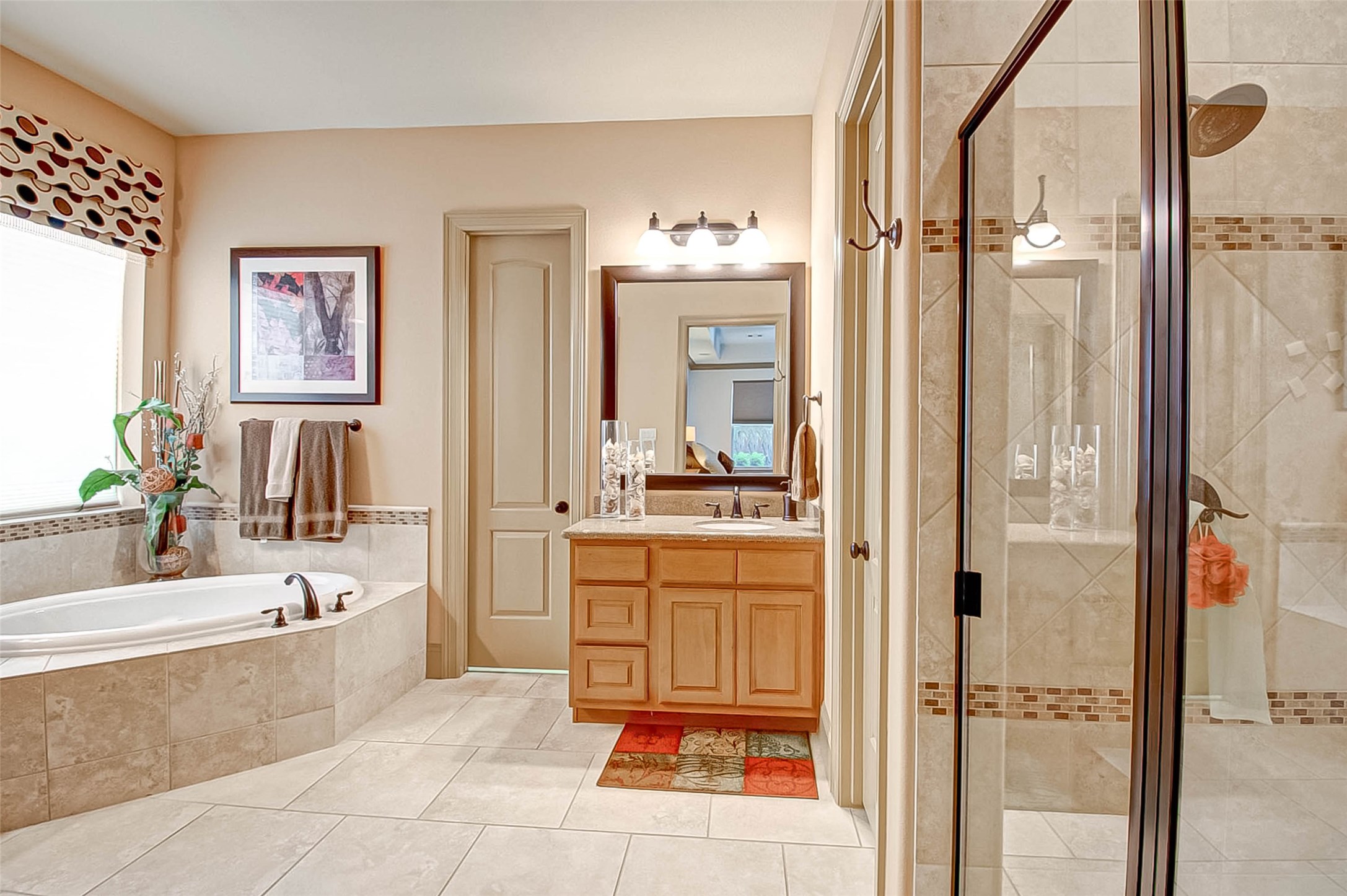 7 Shearling Court Spring, TX 77389 - Photo 34 of 46 a bathroom with a tub sink and mirror