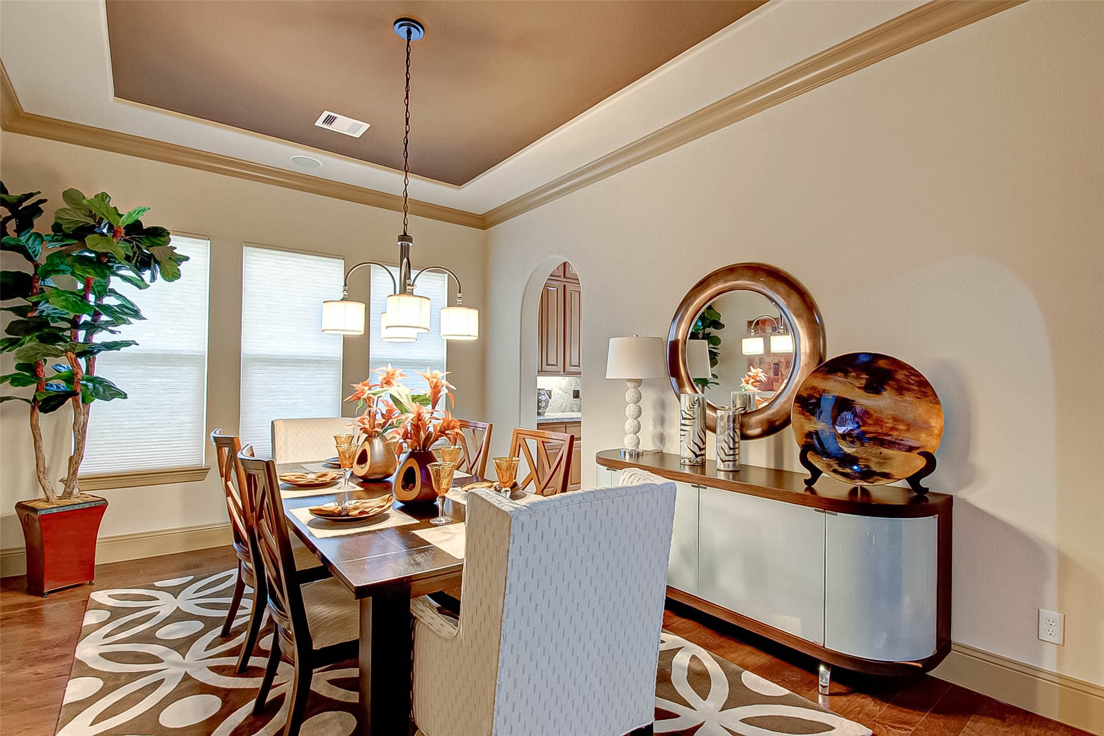 7 Shearling Court Spring, TX 77389 - Photo 8 of 46 a dining room with furniture potted plants and wooden floor