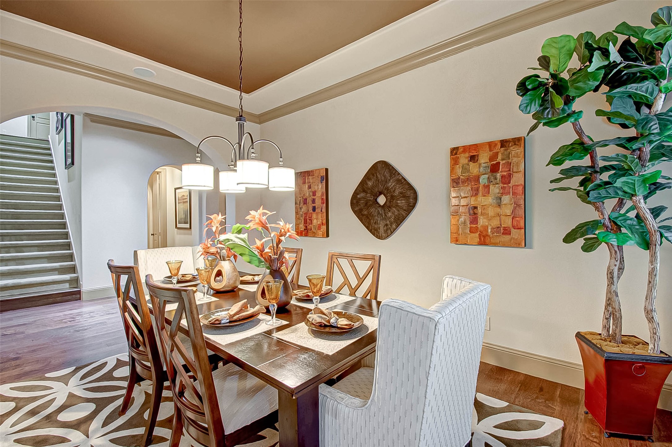 7 Shearling Court Spring, TX 77389 - Photo 9 of 46 a dining room with furniture potted plants and wooden floor