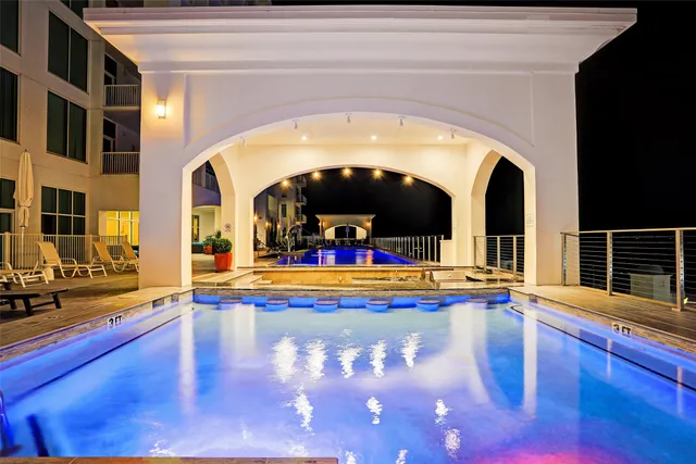 a view of swimming pool with outdoor seating