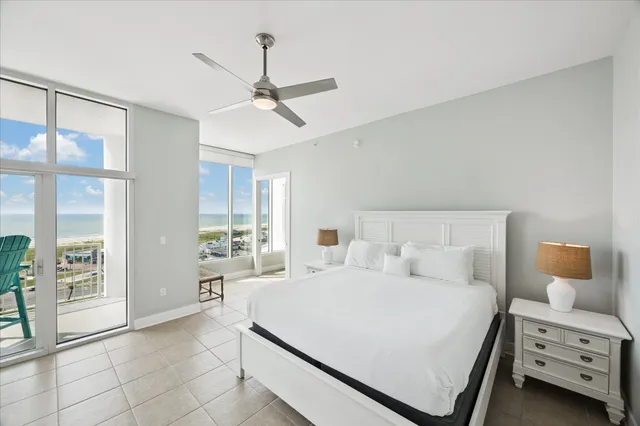 a bedroom with a bed a window and dresser