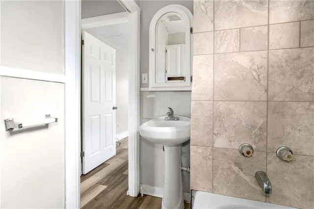 a bathroom with a sink a toilet and bathtub