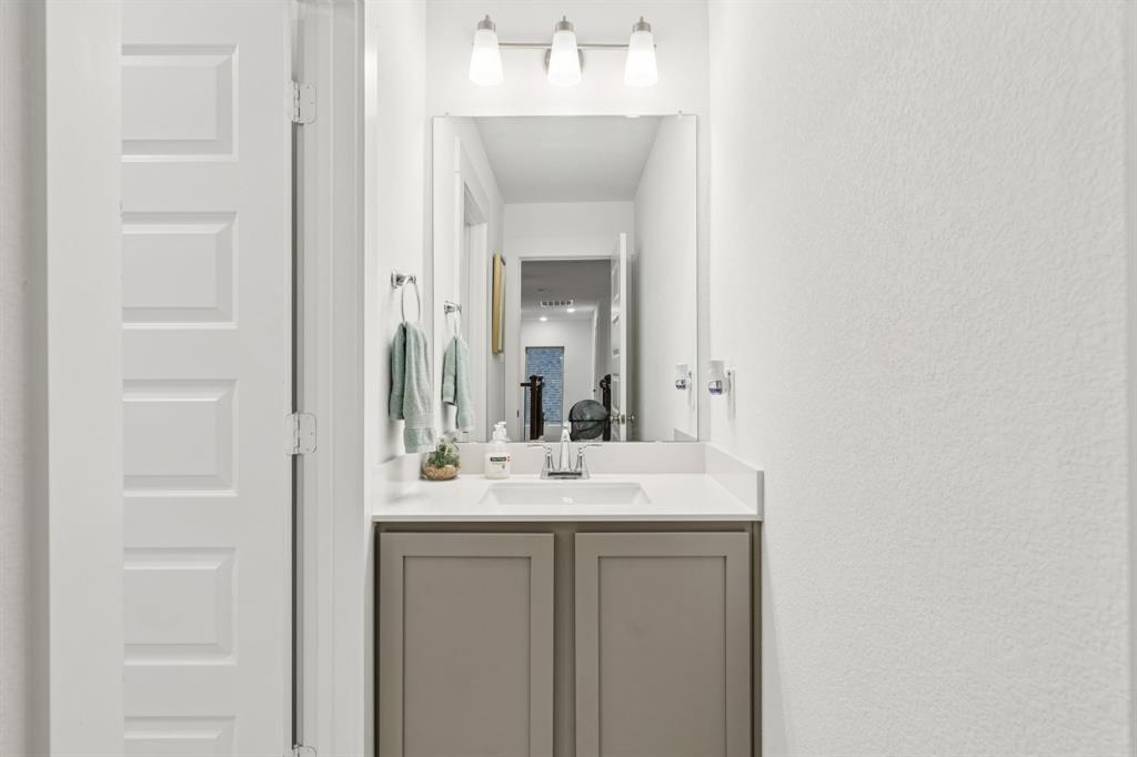 1238 Beaumont Lane Red Oak, TX 75154 - Photo 19 of 29 a bathroom with a sink and a mirror