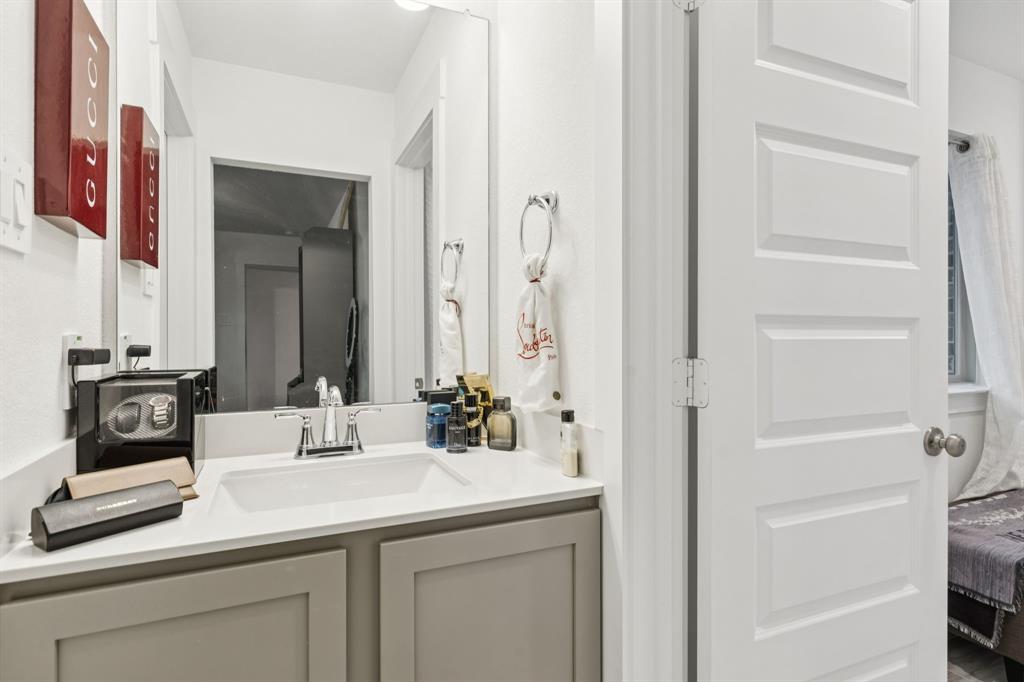 1238 Beaumont Lane Red Oak, TX 75154 - Photo 22 of 29 a bathroom with a sink and a mirror