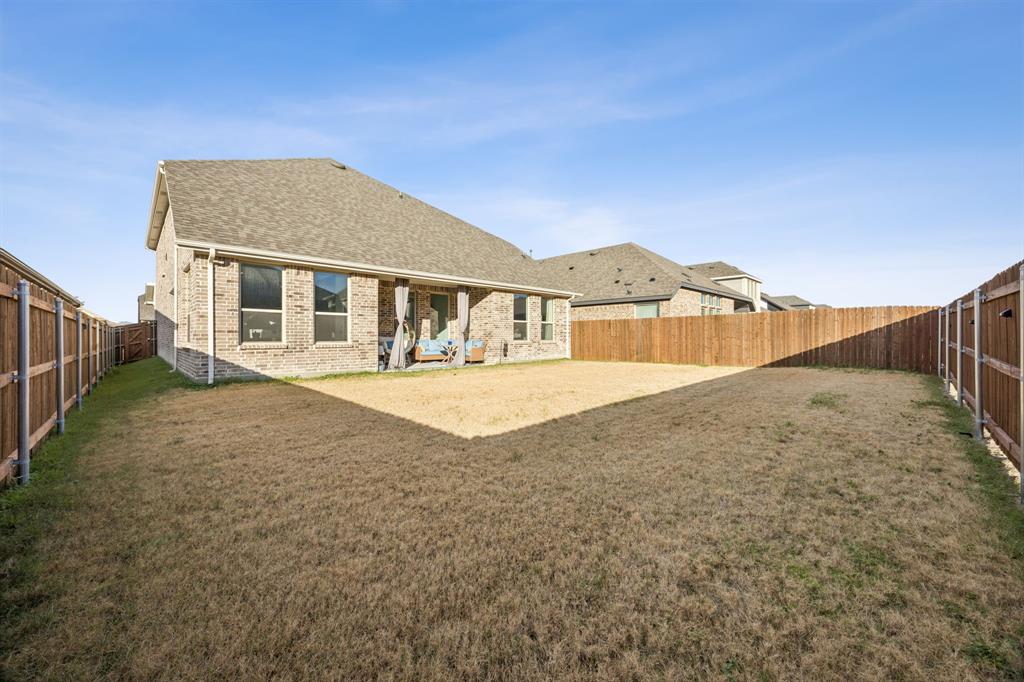 1238 Beaumont Lane Red Oak, TX 75154 - Photo 29 of 29 a view of a house with a yard