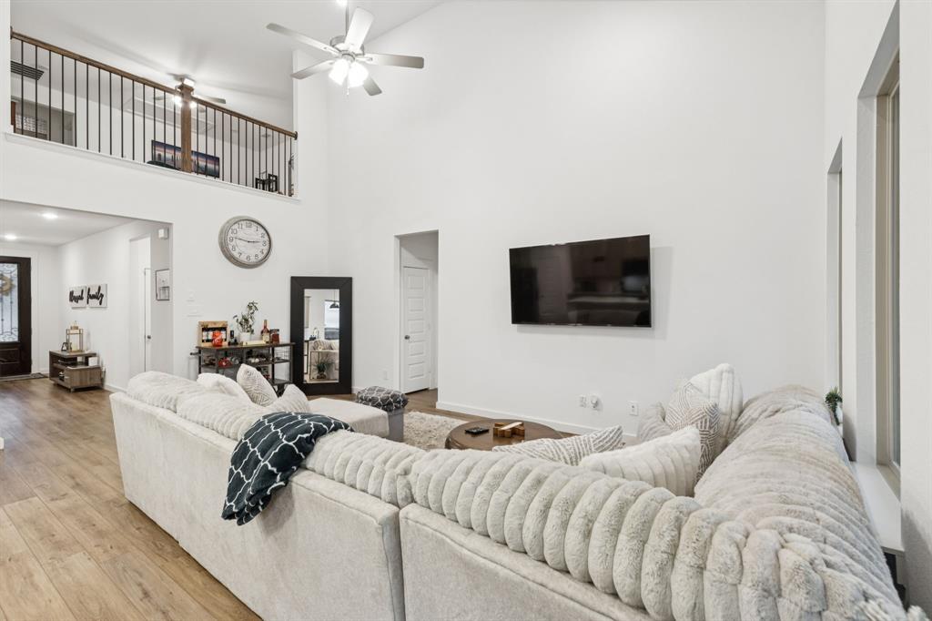 1238 Beaumont Lane Red Oak, TX 75154 - Photo 4 of 29 a living room with furniture and a flat screen tv