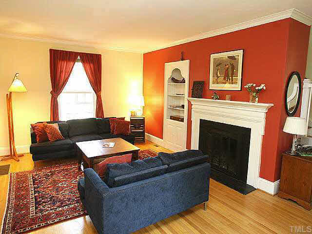 103 Montgomery Street Raleigh, NC 27607 - Photo 2 of 10 a living room with furniture and a fireplace