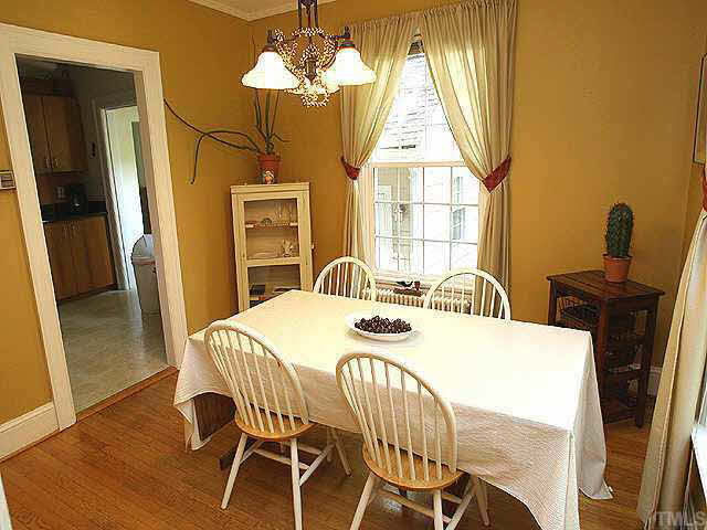 103 Montgomery Street Raleigh, NC 27607 - Photo 5 of 10 a view of a dining room with furniture window and wooden floor