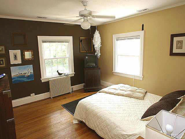 103 Montgomery Street Raleigh, NC 27607 - Photo 7 of 10 a bedroom with a bed and a window