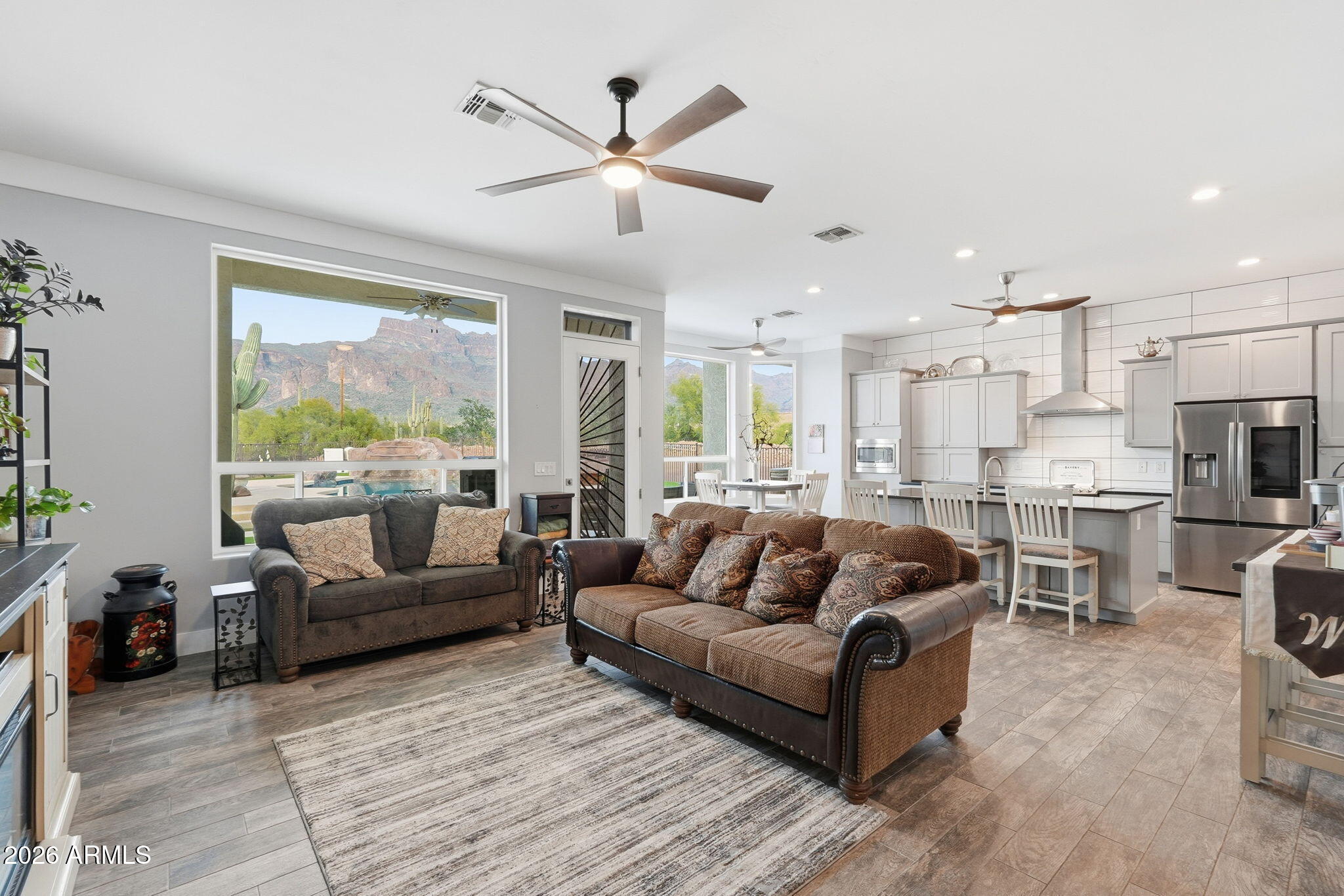 1067 South Trigger Court Apache Junction, AZ 85119 - Photo 11 of 60 a living room with furniture and a large window