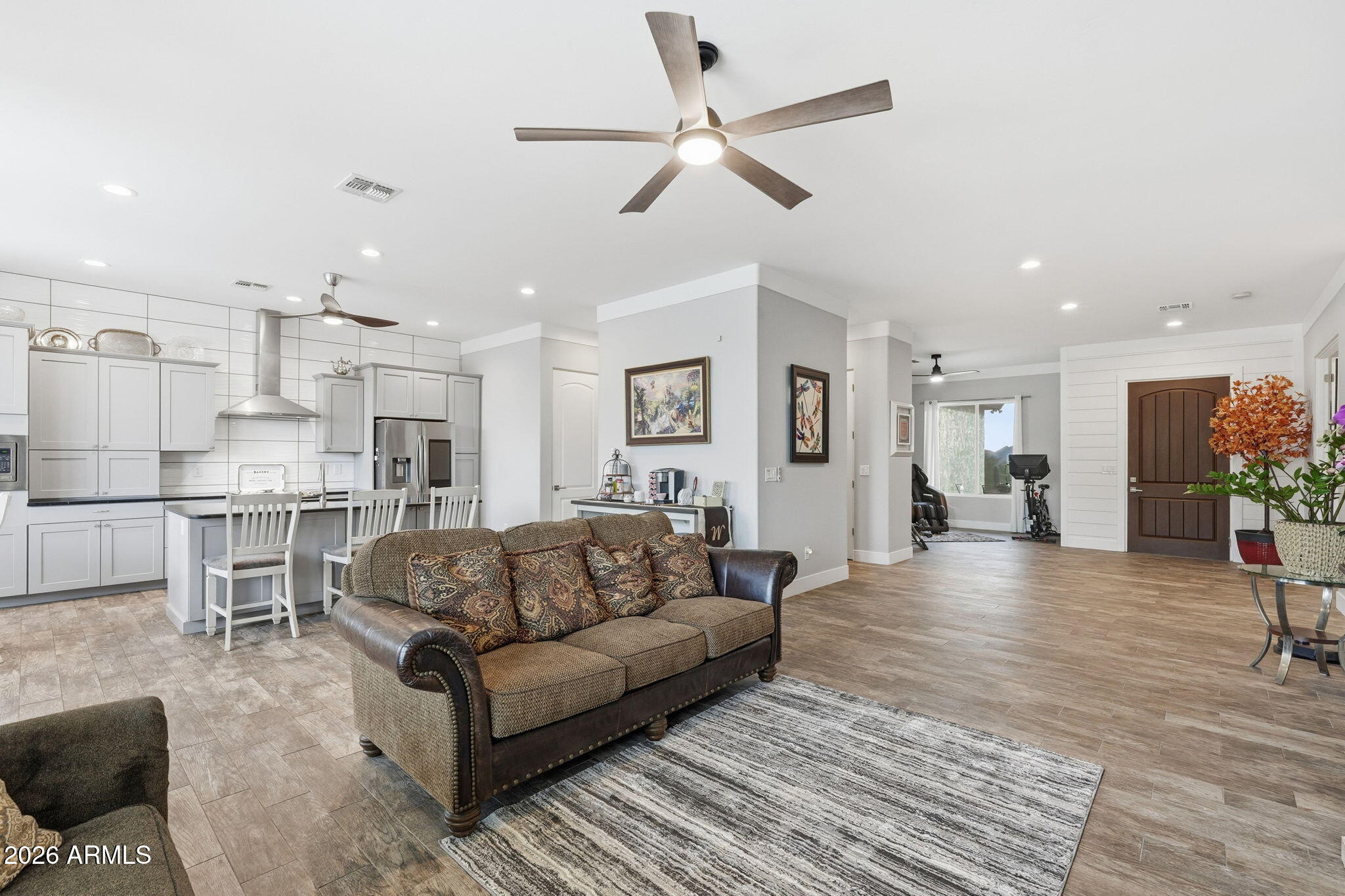 1067 South Trigger Court Apache Junction, AZ 85119 - Photo 12 of 60 a living room with furniture and kitchen view