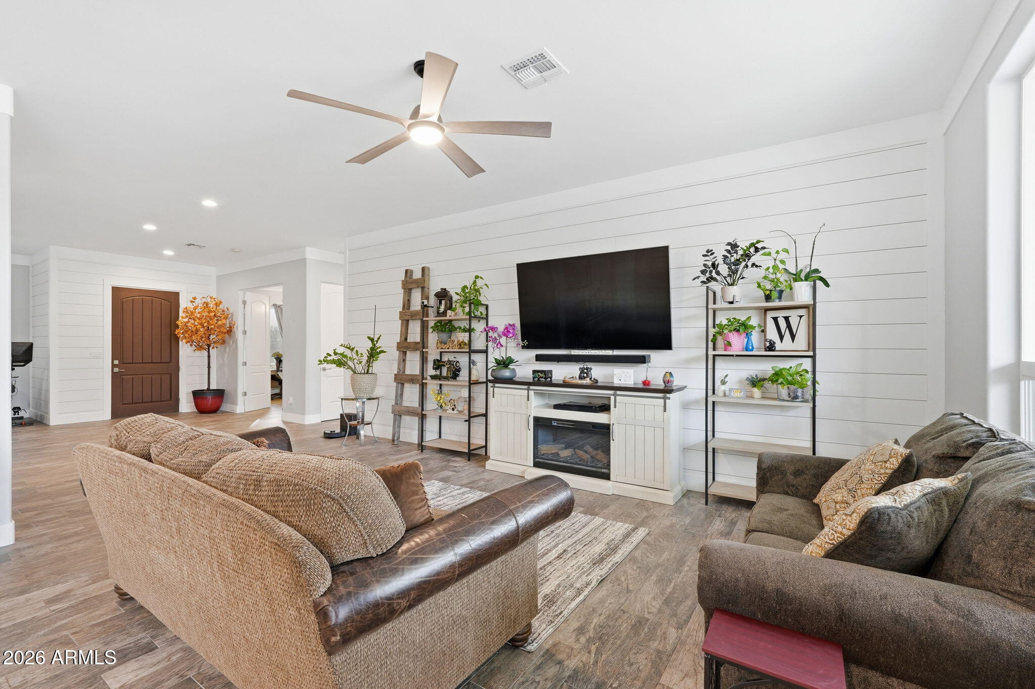 1067 South Trigger Court Apache Junction, AZ 85119 - Photo 13 of 60 a living room with furniture and a flat screen tv
