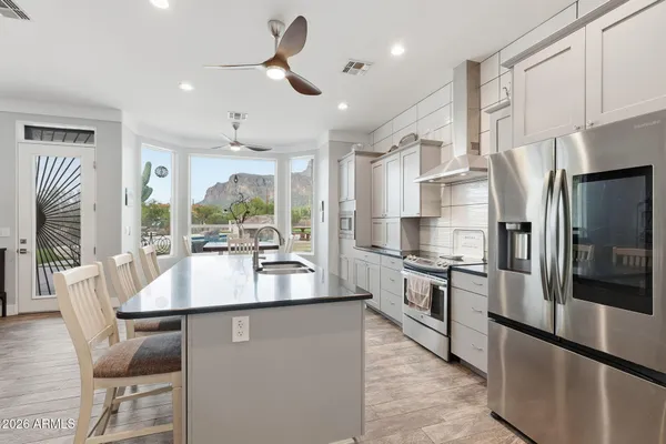 a bedroom with a bed and wall painting