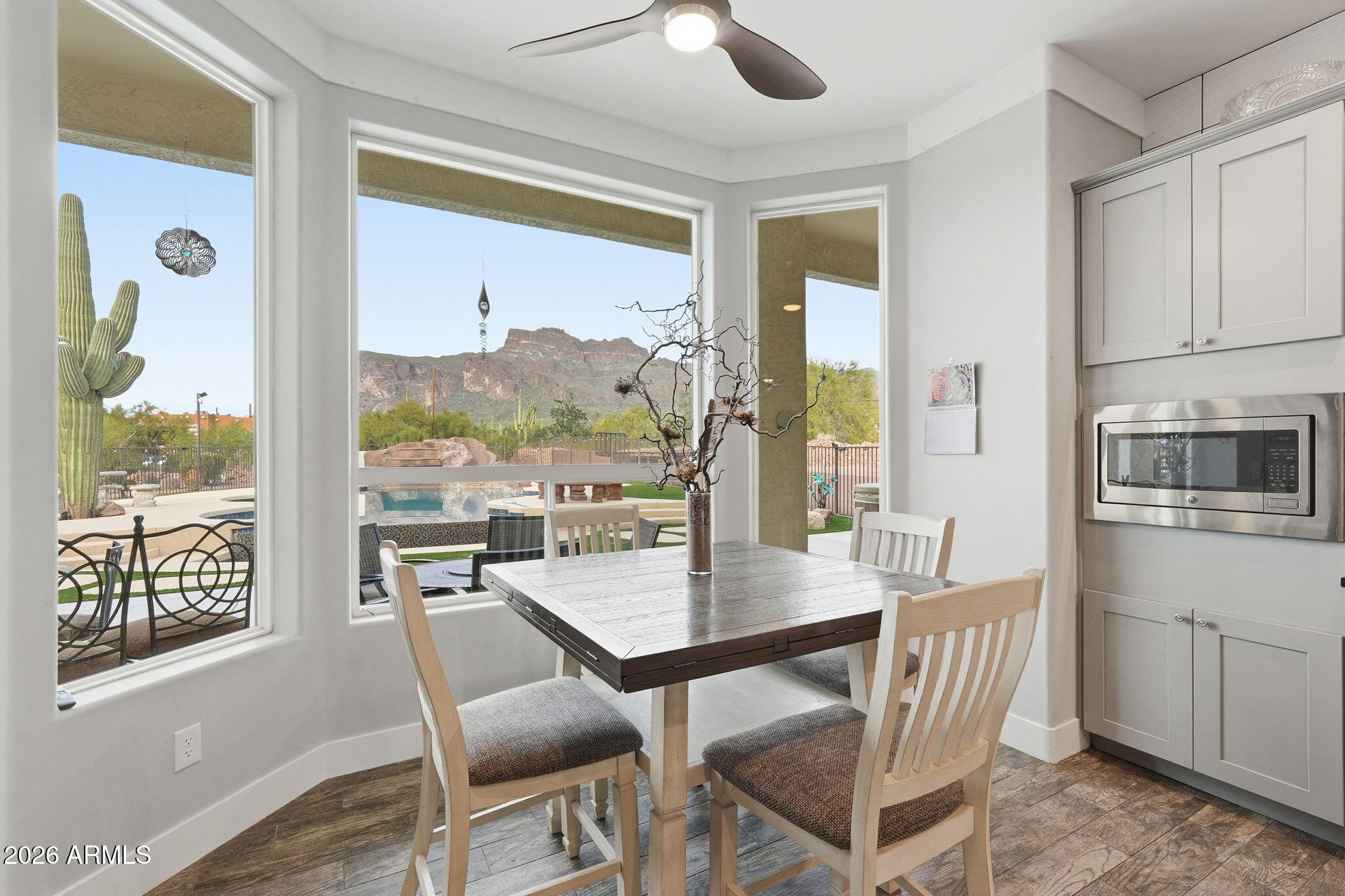 1067 South Trigger Court Apache Junction, AZ 85119 - Photo 21 of 60 a view of a dining room with furniture window and outside view