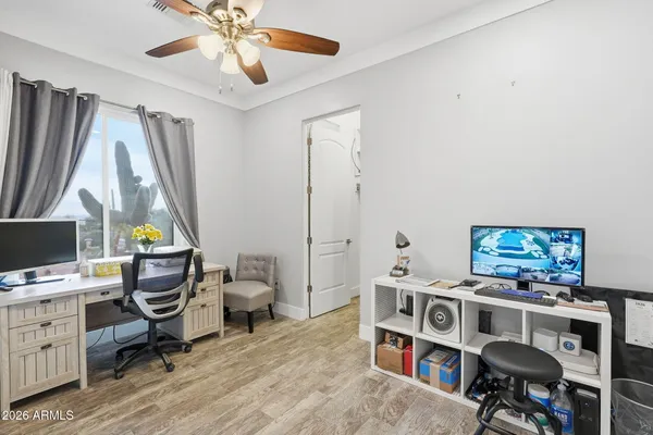 a bedroom with furniture and a window