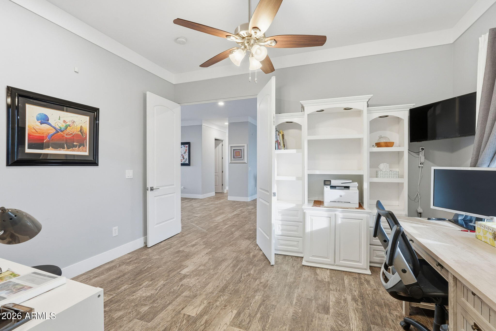 1067 South Trigger Court Apache Junction, AZ 85119 - Photo 25 of 60 a view of workspace with wooden floor and ceiling fan