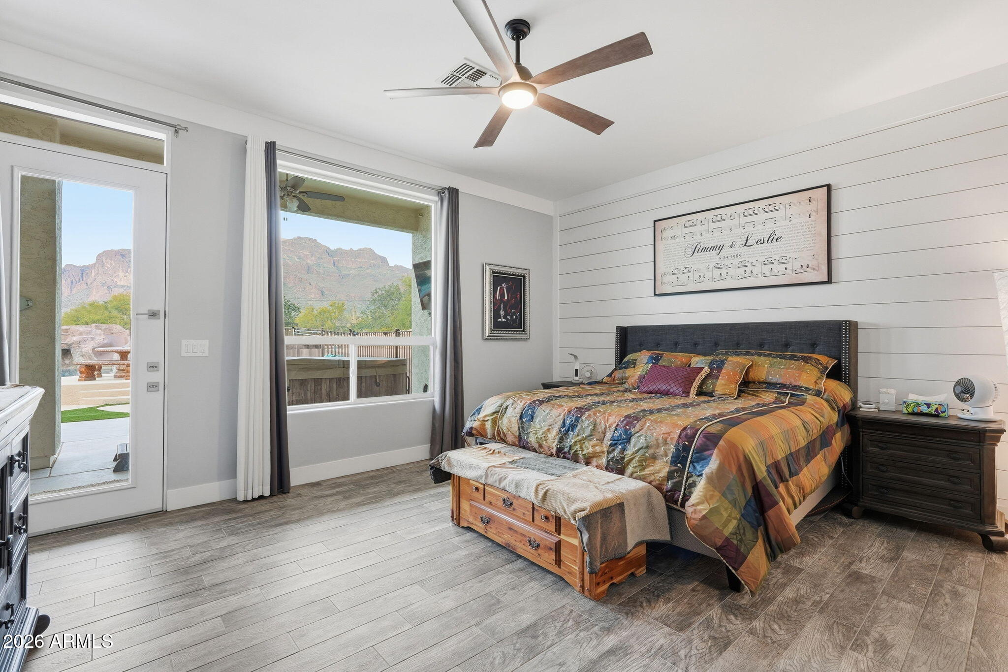 1067 South Trigger Court Apache Junction, AZ 85119 - Photo 27 of 60 a bed sitting in a spacious bedroom next to a window