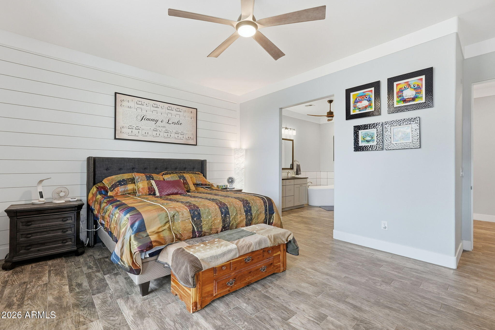 1067 South Trigger Court Apache Junction, AZ 85119 - Photo 28 of 60 a bedroom with a bed and wall painting