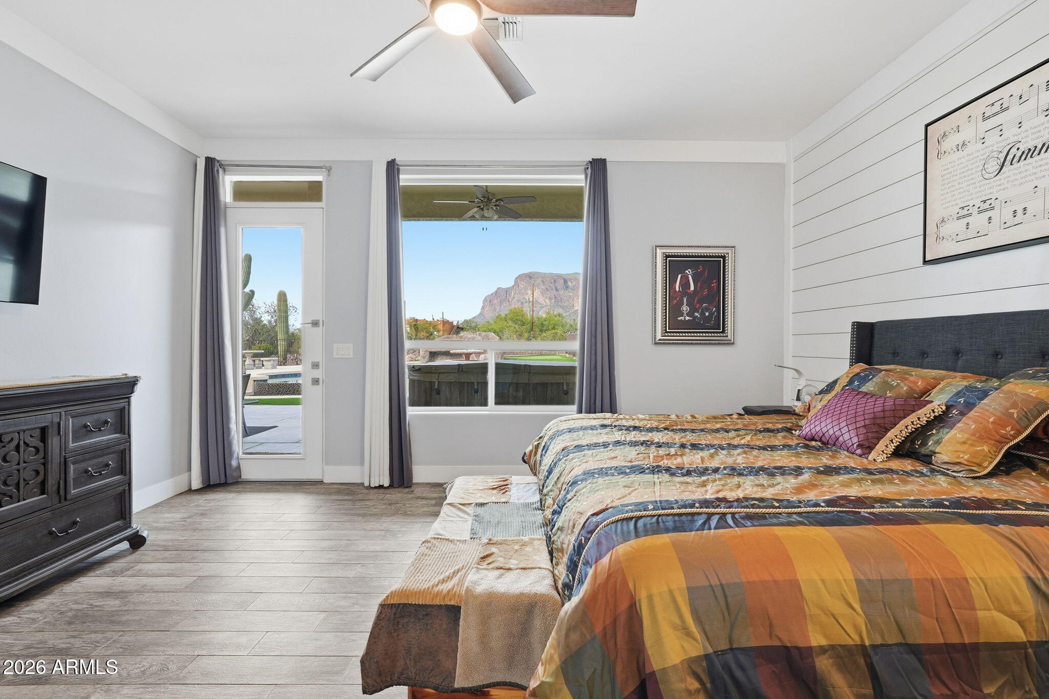 1067 South Trigger Court Apache Junction, AZ 85119 - Photo 30 of 60 a bedroom with a large bed and a balcony