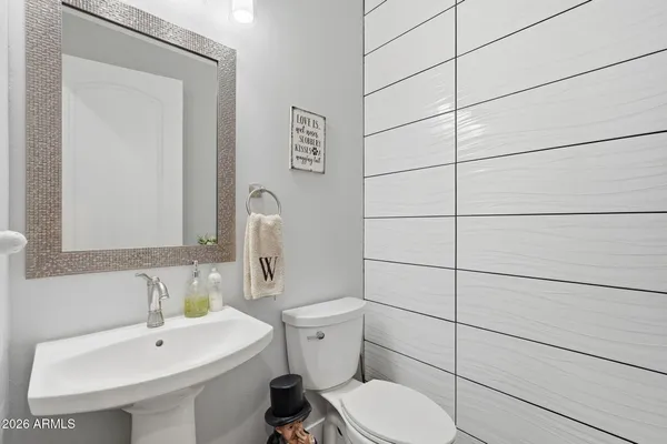 a view of a house with a backyard and a patio