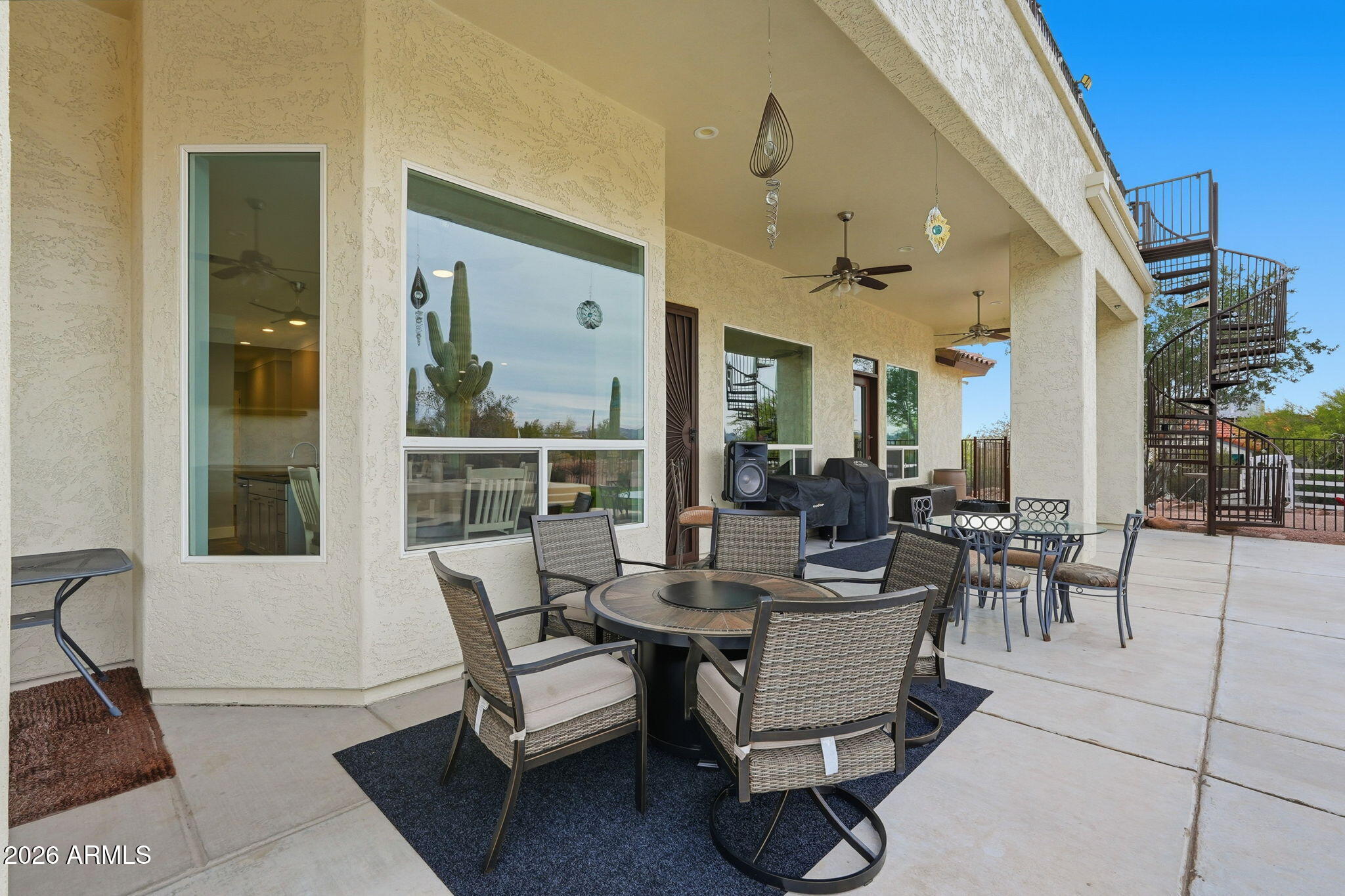 1067 South Trigger Court Apache Junction, AZ 85119 - Photo 46 of 60 a dining room with furniture and wooden floor