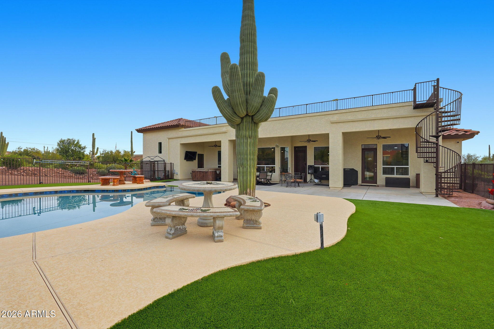 1067 South Trigger Court Apache Junction, AZ 85119 - Photo 51 of 60 a view of a house with swimming pool and porch