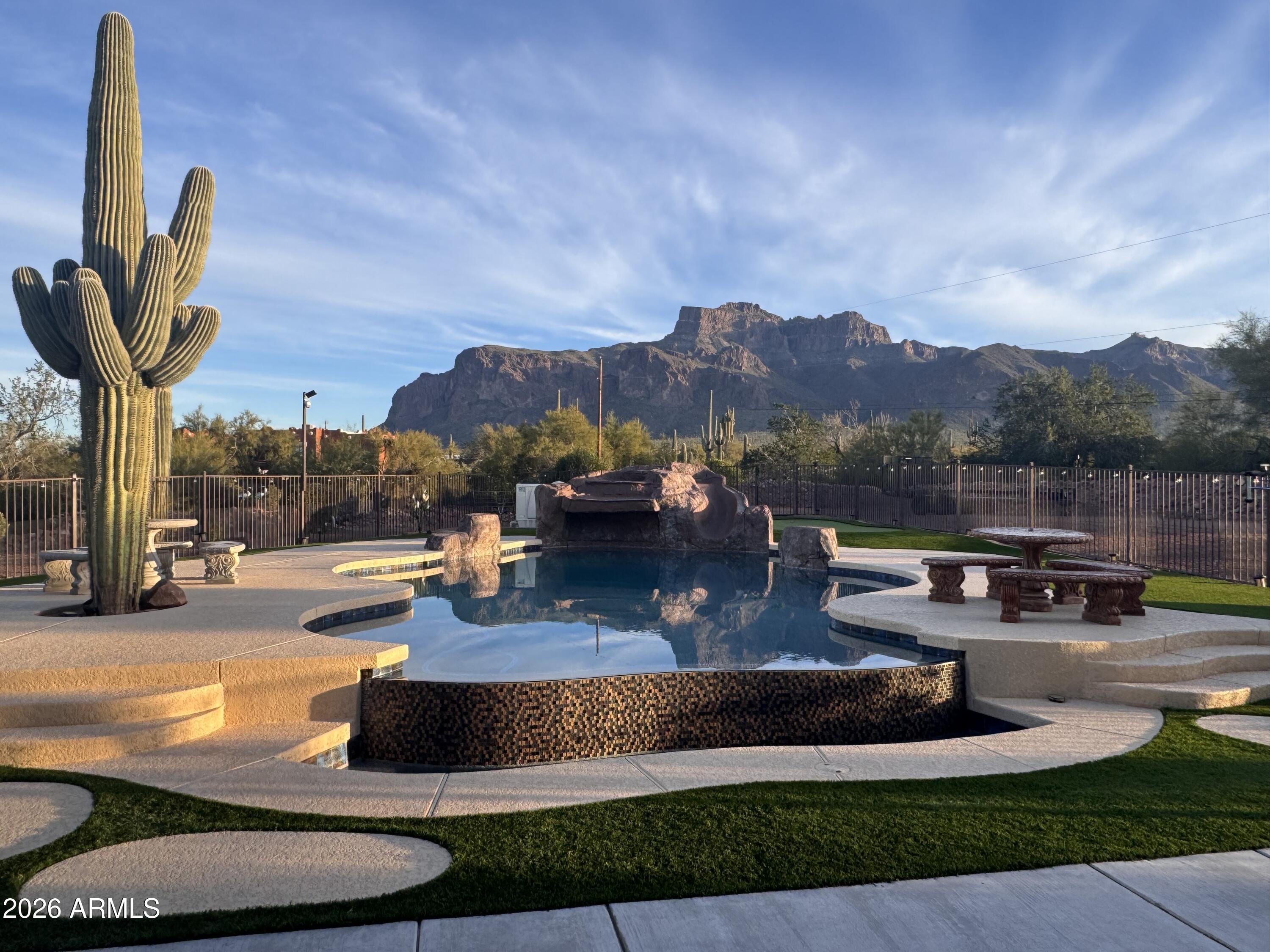 1067 South Trigger Court Apache Junction, AZ 85119 - Photo 52 of 60 a view of a swimming pool with a patio