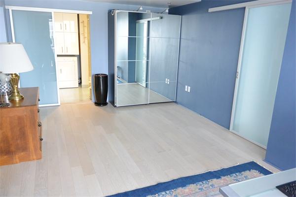 8 Museum Way, Unit 1201 Cambridge, MA 02141 - Photo 11 of 25 a view of a room with a large bed and a large window