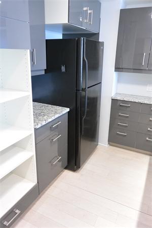 8 Museum Way, Unit 1201 Cambridge, MA 02141 - Photo 5 of 25 a kitchen with granite countertop a refrigerator and a stove