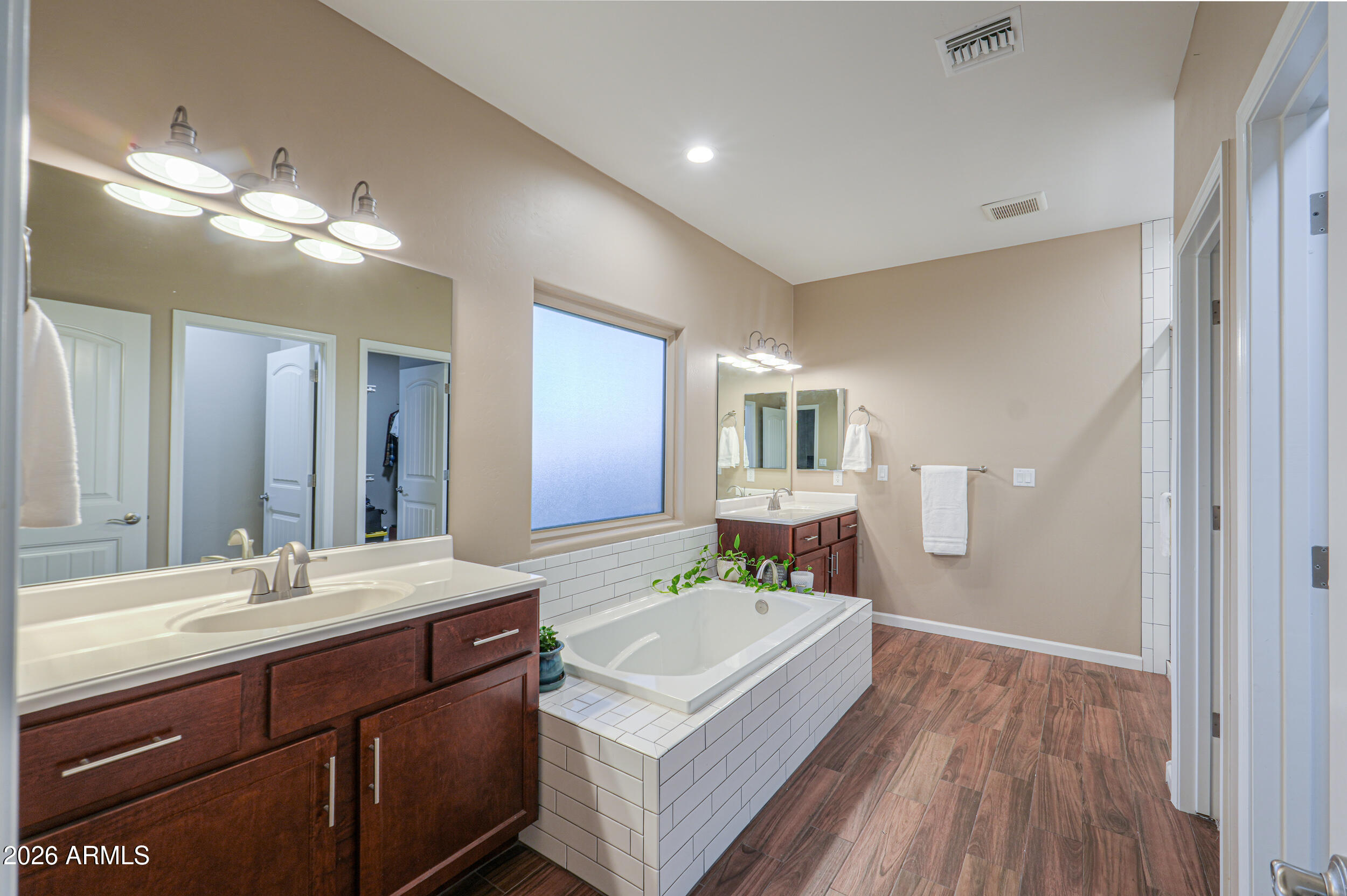 1487 South Mountain View Road Apache Junction, AZ 85119 - Photo 4 of 60 a bathroom with a sink double vanity granite and a mirror