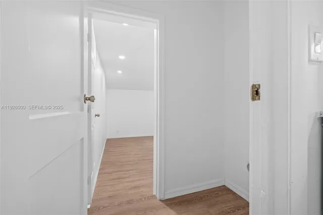 a bathroom with a sink toilet a mirror and shower