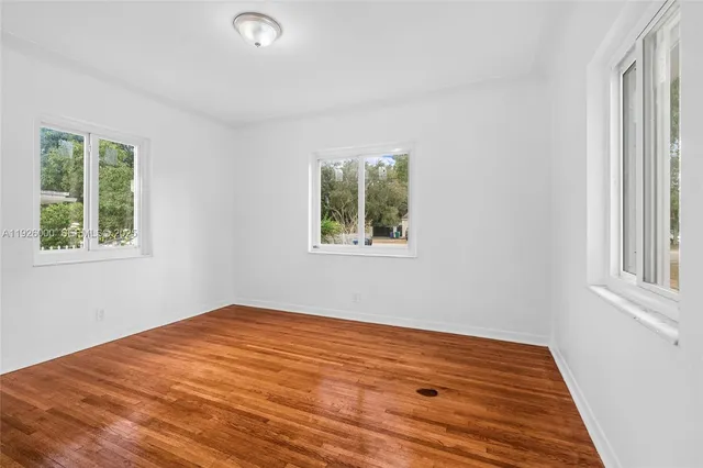 a view of a house with a tree