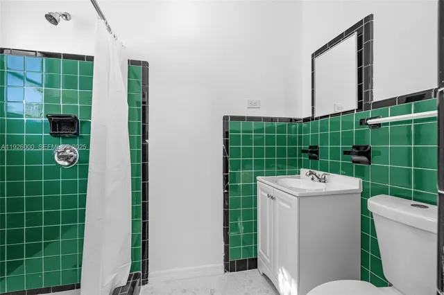 an aerial view of a house with a swimming pool