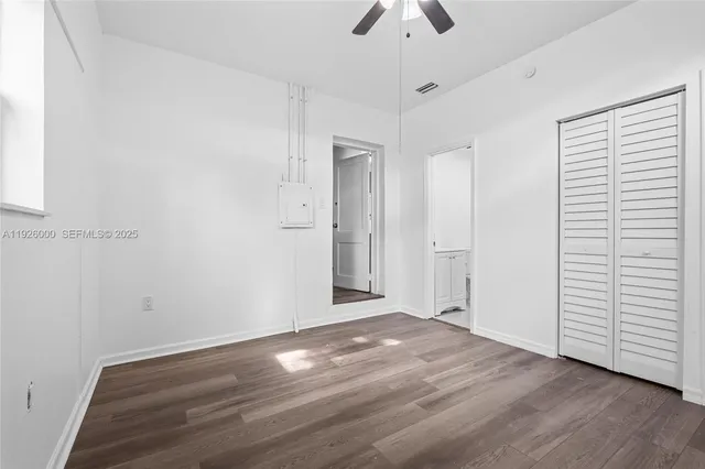 an aerial view of a house with a yard basket ball court and outdoor seating