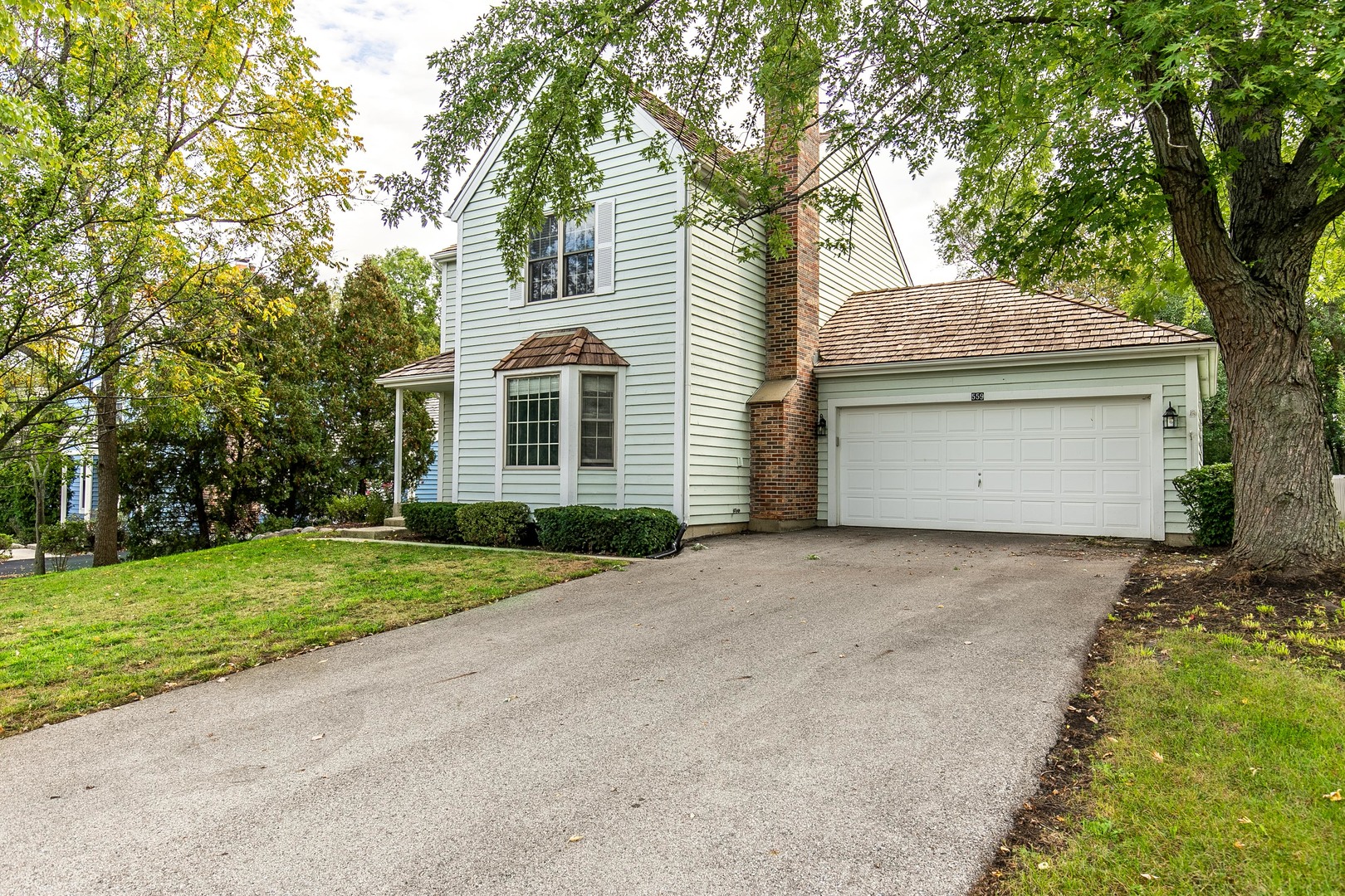 559 Cross Road Gurnee, IL 60031 - Photo 24 of 27 a front view of a house with a yard and garage