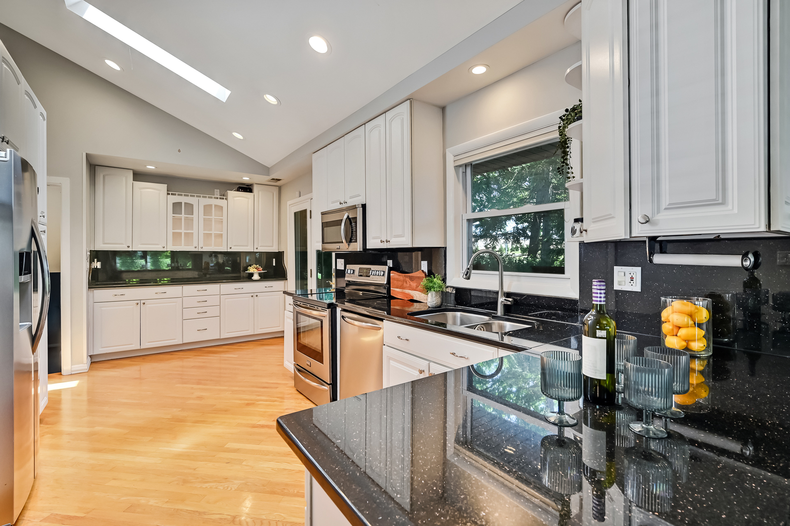 545 Highland Road Hinsdale, IL 60521 - Photo 8 of 29 a kitchen with stainless steel appliances granite countertop sink stove top oven and cabinets