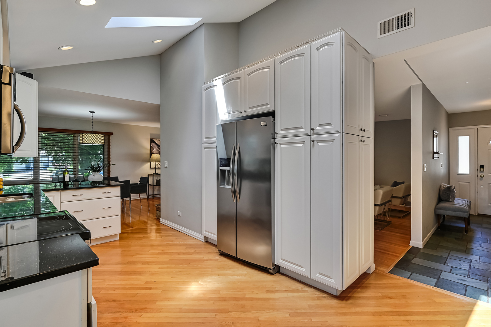 545 Highland Road Hinsdale, IL 60521 - Photo 10 of 29 a kitchen with stainless steel appliances granite countertop a refrigerator and a sink