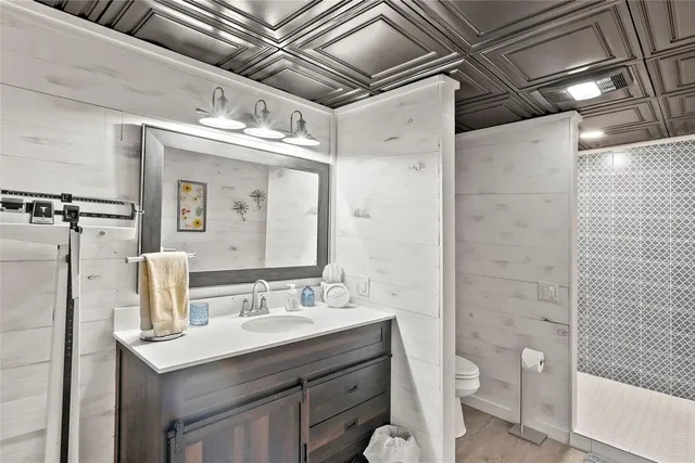 a front view of a house with a yard and mountain view