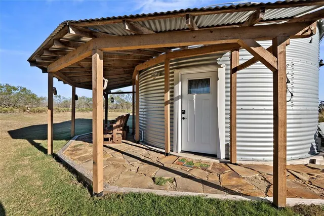 a bedroom with furniture and a chandelier