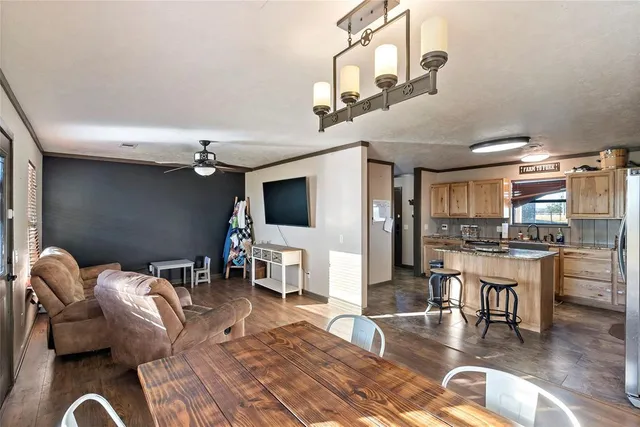 a kitchen with refrigerator and cabinets