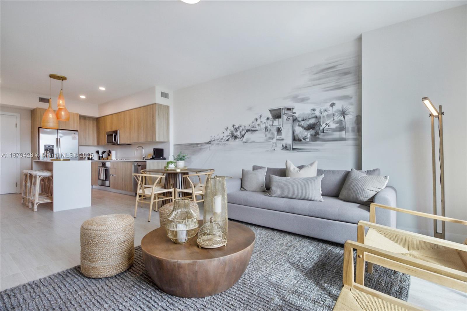 a living room with furniture and a view of kitchen